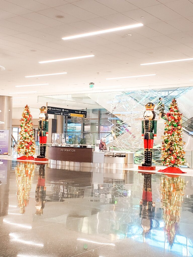 Picture of Christmas trees and the nutcracker soldiers at the SLC international airport
