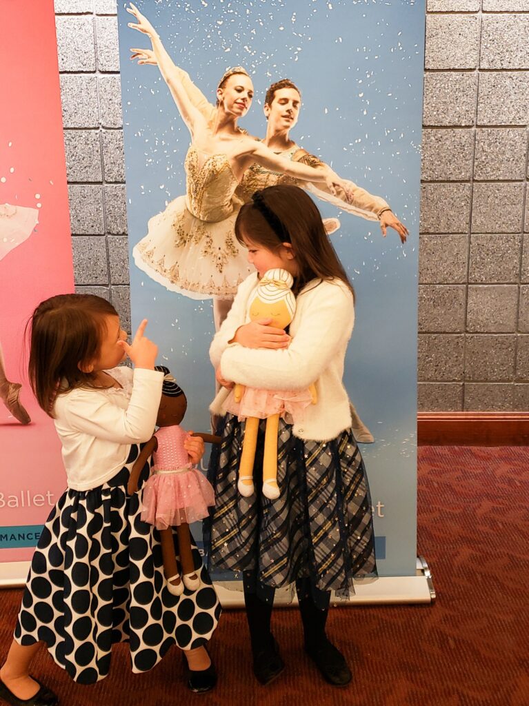 picture of 2 girls standing in front of a picture of ballerinas at Covey Center in Provo, Utah